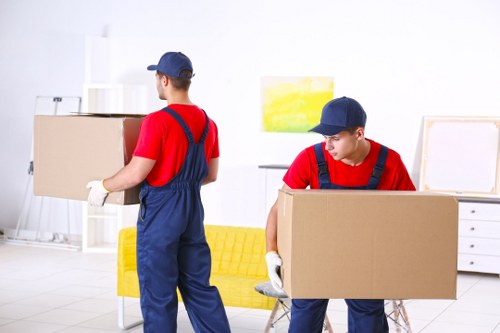 Removal van and moving boxes prepared for a home move in Tolworth