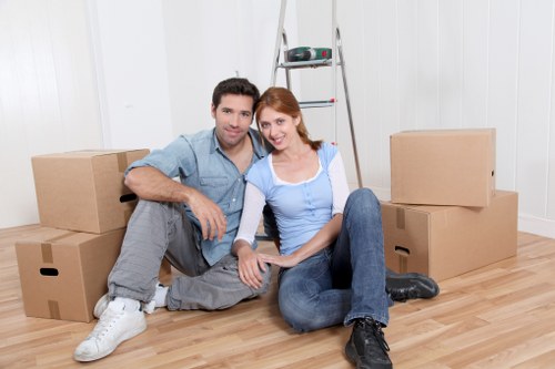 Packed boxes and household items ready for transport in Tolworth