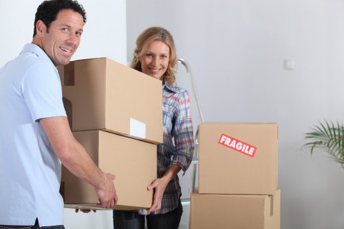 Professional movers handling furniture during a home move in Tolworth