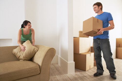 Prepared boxes and furniture ready for unloading at a new Tolworth home
